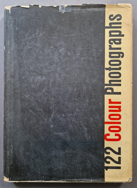 The photobook cover of 122 Colour Photographs (122 Farvefotografier) by Keld Helmer-Petersen in black, with most of the title presented also in black on a white stripe on the right except for the word "colour" which is in red.