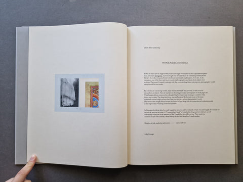 An open book spread, showing printed text on the right page and a small inset artwork on the left page.