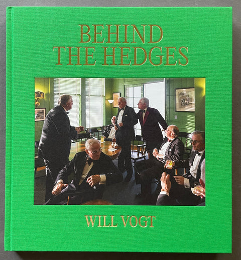 Front cover of Behind the Hedges by Will Vogt with a color photograph of old men in suits having drinks in a room