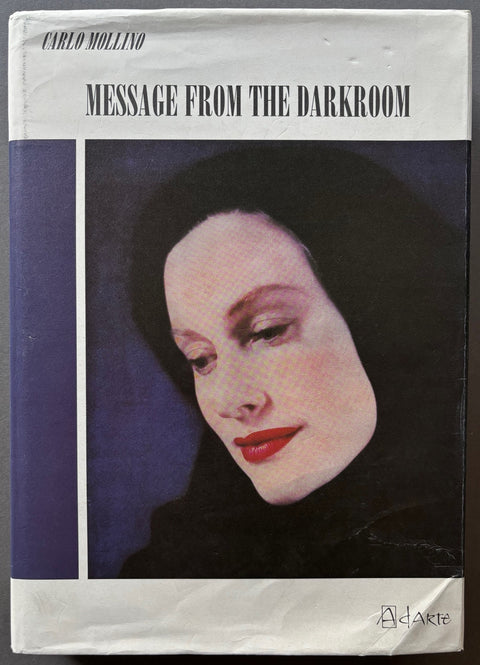 Book titled @message From The Darkroom' by Carlo Mollino with a cover featuring the photograph of woman.