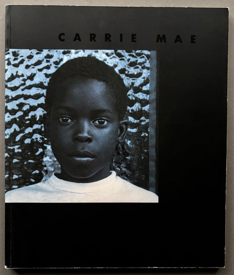 Book titled 'Carrie Mae Weems' with a black cover featuring an image of a young Afro-American boy.
