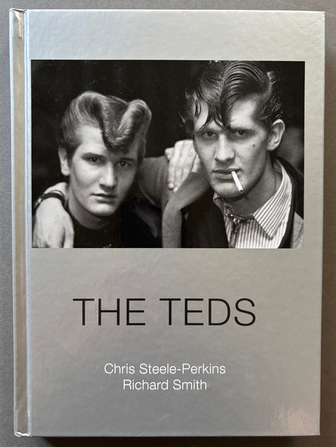 Book titled 'The Teds' by Chris Steele-Perkins and Richard Smith with a silver cover featuring a black and white image of 2 men with Teddy boy hair styles.
