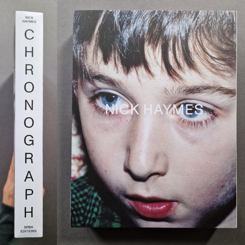 Chronograph: A Nick Haymes photographic art book, showing the white spine with vertical black text on the left and the front cover featuring a close-up portrait of a child with blue eyes on the right.