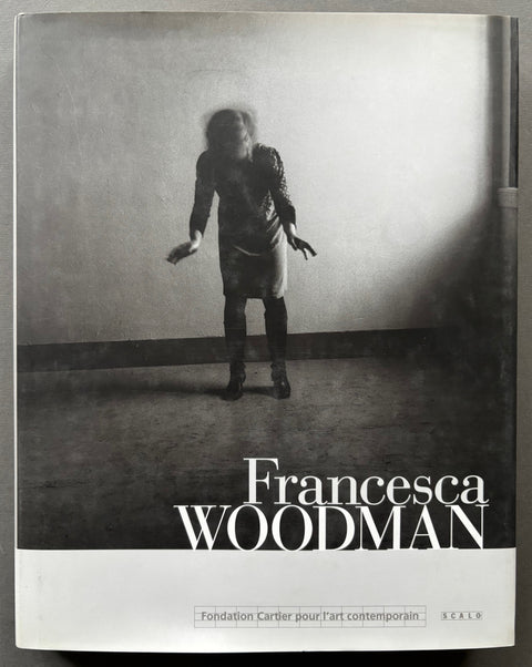 Book titled 'Francesca Woodman' by Francesca Woodman with a cover featuring the image of a woman with her face blurred.