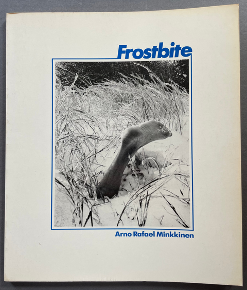 Front cover of Frostbite by Arno Rafael Minkkinen with a black and white image of a leg in snow.