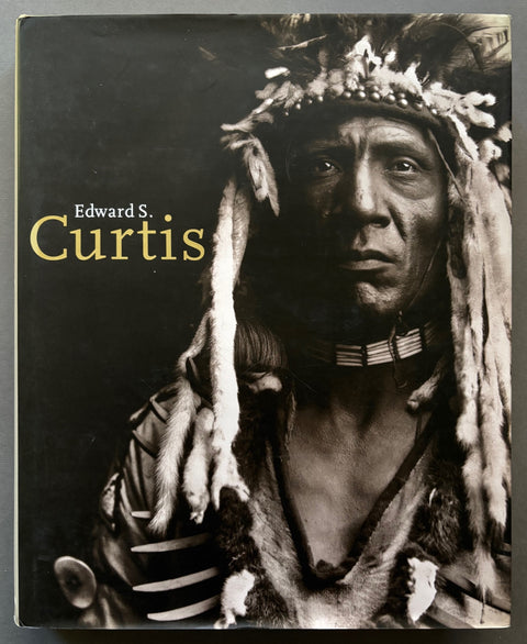 Book titled ' Edward S. Curtis' by Hans Christian Adam with a cover featuring the image of a Native American.