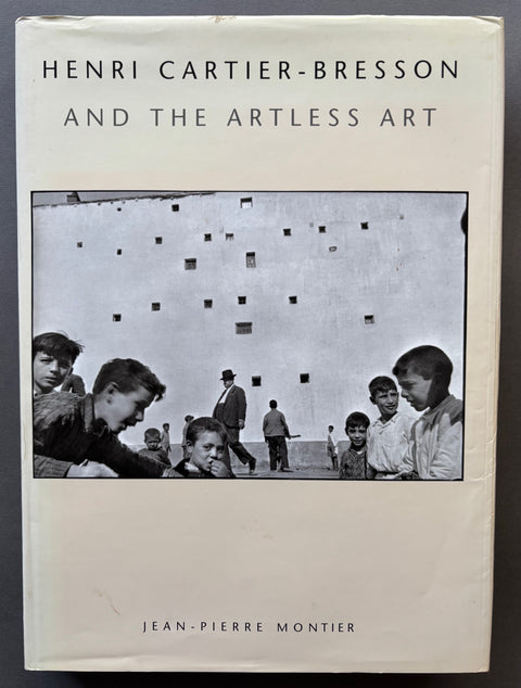 Book titled 'Henri Cartier-Bresson and the Artless Art' by Jean-Pierre Montier with a cover featuring an image of young boys in front of a high wall.