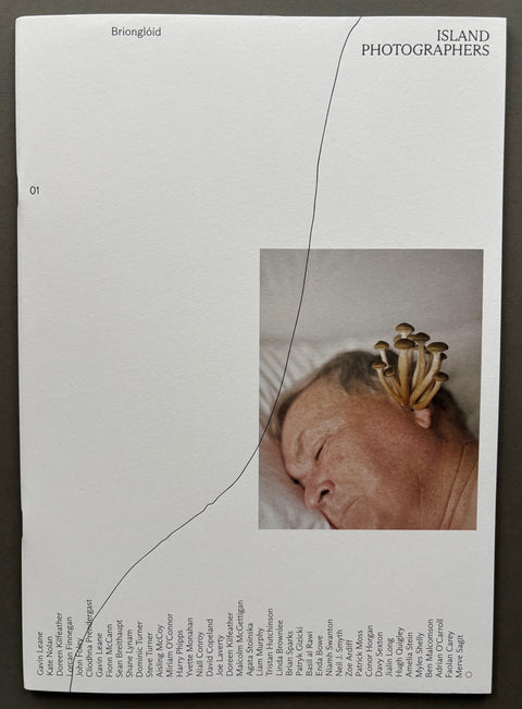 Book titled 'Briongloid' by various artists with a white cover featuring the image of a sleeping man with mushrooms coming out of his ear.