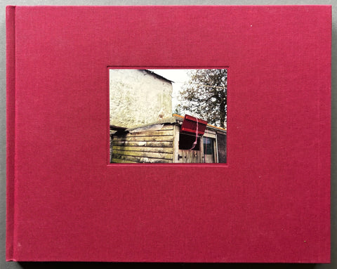 Book titled 'The Moth' by Jem Southam with a burgundy cover featuring the image of a shed.