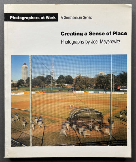 Book titled 'Creating a Sense of Place' by Joel Meyerowitz with a white cover featuring an image of a baseball field.