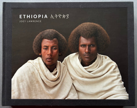 Book titled 'Ethiopia' by Joey Lawrence with a black cover featuring the tipped in image of 2 men sitting side by side