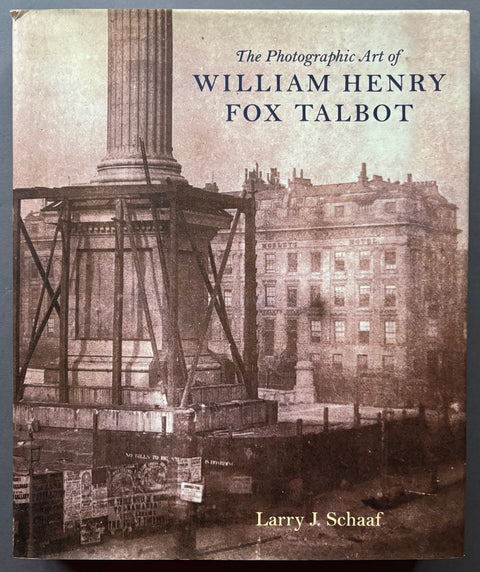 Book titled 'The Photographic Art of William Henry Fox Talbot' by Larry J Schaaf with a cover featuring the black and white image of a building and a monument surrounded by scaffolding.