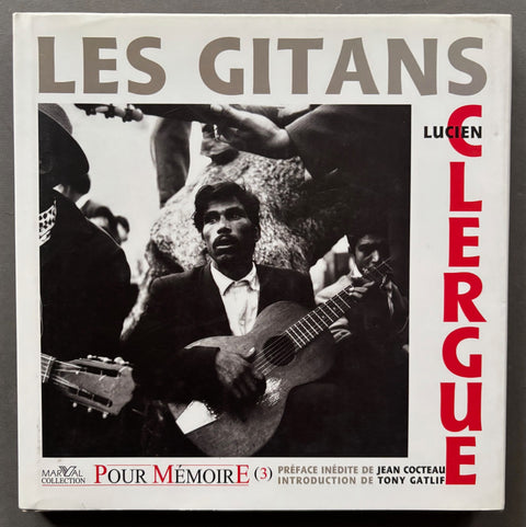 Book titled 'Les Gitans' by Lucien Clergue with a cover featuring the image of a man in a suit playing the guitar.