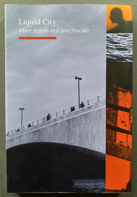 Book titled 'Liquid City' by Marc Atkins and Iain Sinclair with a cover featuring the image of a bridge.