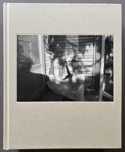 Book titled 'Taken From Time' by Mark Steinmetz with a white cover including a black and white photograph of a woman.