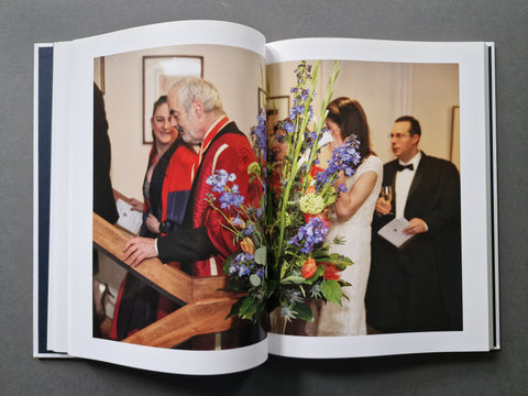 An open hardcover book, showing tone big photograph.