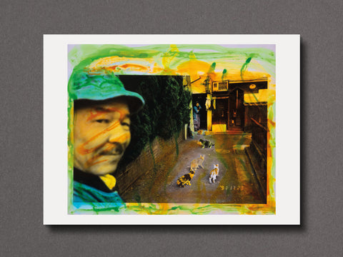 An abstract art print featuring a portrait of a man (Masahisa Fukase) in a green cap and a street scene with cats, framed by a white border and displayed against a dark gray background.