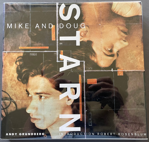 The front cover of the book 'StarN' by Mike and Doug, with Andy Grundberg's introduction by Robert Rosenblum, photographed flat on a dark gray surface.