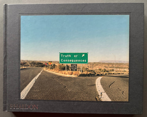 Book titled 'Truth or Consequences' by Nick Waplington with a grey cover featuring the tipped in image of a junction on a road with a sign leading to a place called Truth or Consequences.