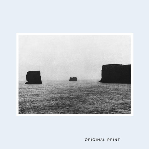 The limited edition signed print of a seascape with rocks in black and white.