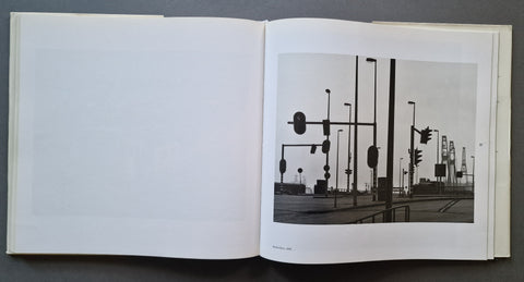 An open book showing a photo of traffic lights on the right page