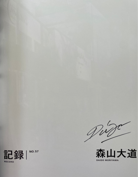 Book with a signature and text on a white background