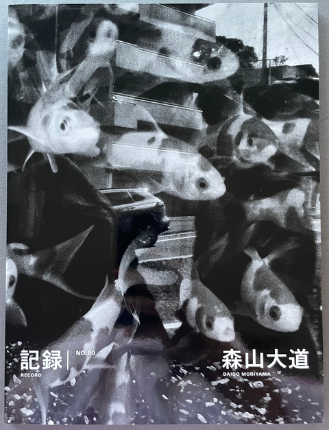 Front cover of Record No.60 by Daido Moriyama with a black and white photo of fishes and reflection of a car and building.