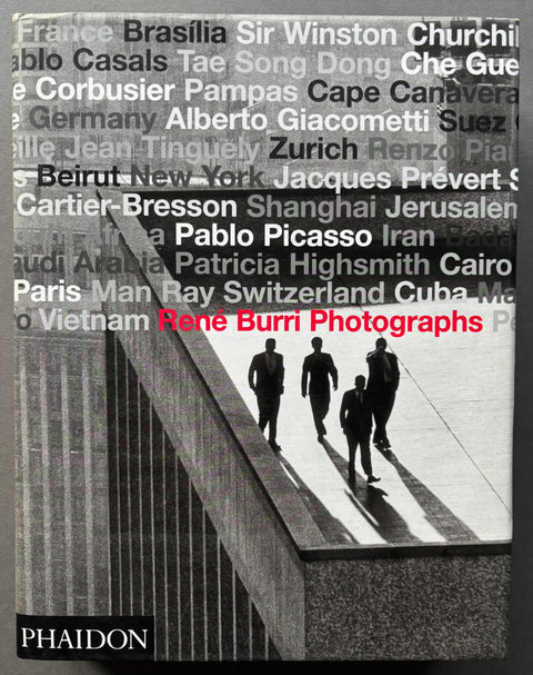 Book titled 'René Burri: Photographs' by René Burri with a cover featuring the black and white image of 4 men in suits walking across a building rooftop.
