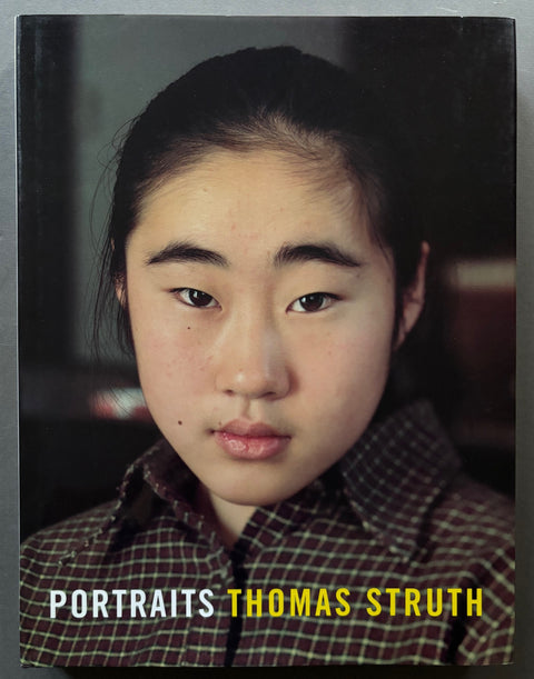 Book titled portraits by Thomas Struth with a cover featuring head-shot of a girl.