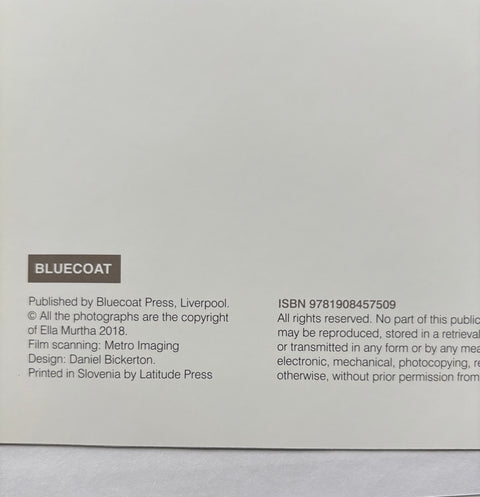 Back cover of a book with text and ISBN information on a gray background