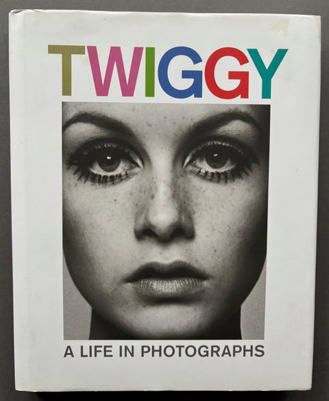 Book titled 'Twiggy: A Life in Photographs' with a white cover featuring a black and white head shot of Twiggy.
