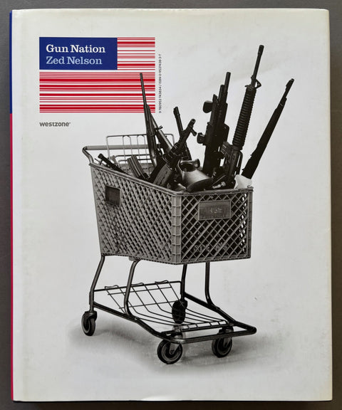 Book titled 'Gun Nation' by Zed Nelson with a cover featuring a photograph of a shopping cart full of guns.