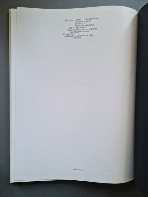 An open book showing printed copyright text at the top