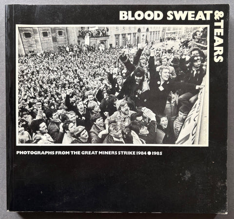 Book titled 'Blood, Sweat & Tears' with a black cover featuring an image of a large crowd of people.