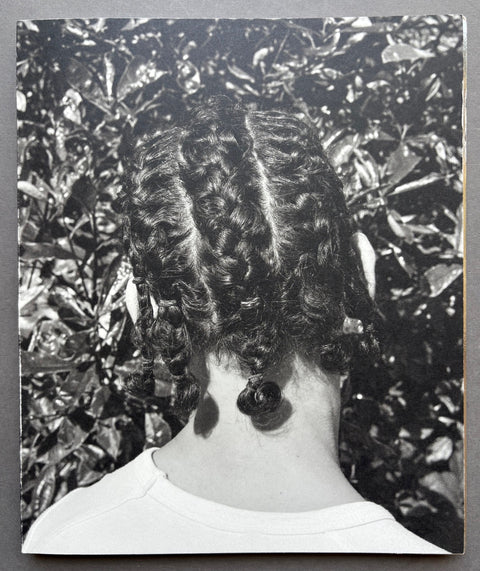 Book titled 'Mixedness is my Mythology' by Farren van Wyk with the image of the back of the head of a girl with braids on the front cover.