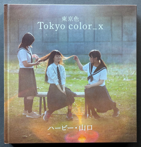 Book titled 'Tokyo Color_X' by Herbie Yamaguchi with a cover featuring the image of threes girls in school uniform.