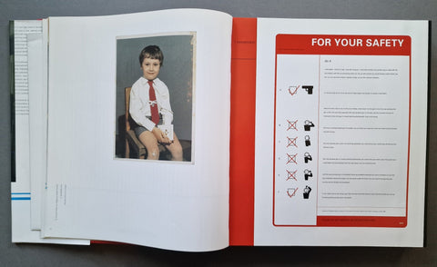 An open book, showing a printed safety page with text and icons on the right and a small inset photo of a child on the left page.
