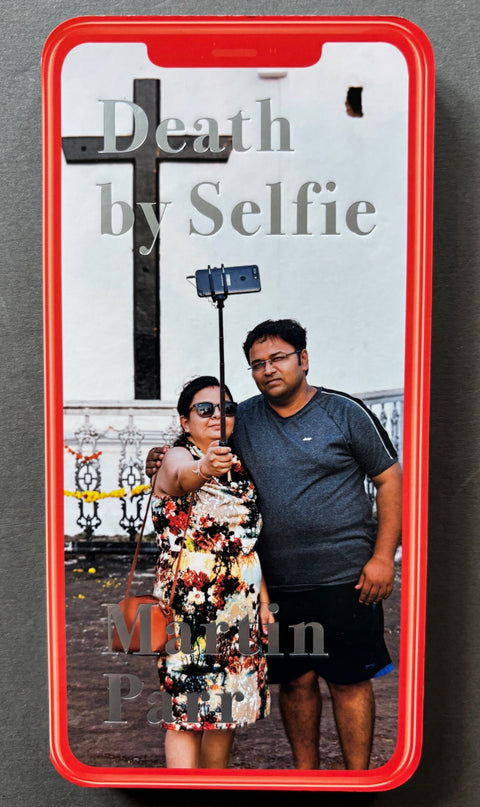 Book titled 'Death by Selfie' by Martin Parr with a cover featuring the image of an Indian couple taking a selfie.