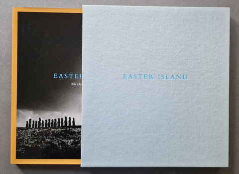 A book titled 'EASTER ISLAND' by Michael Kenna, light blue slipcase and orange hardback