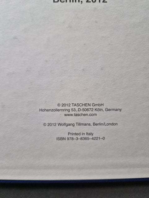 A close-up of a book's printed back cover or copyright page, showing text including 'Berlin, 2012', publisher information for Taschen GmbH, and ISBN details on a light gray paper background.