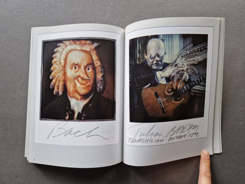 An open book showing two big polaroids on each page