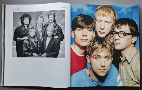 An open book showing two printed pages side by side. The left page is a black-and-white group portrait, and the right page shows a color group portrait against a blue sky background.