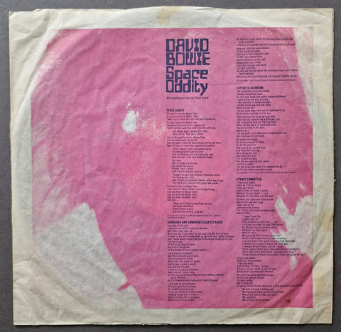 David Bowie Space Oddity vinyl record sleeve, showing the pink and beige cover art with track listings printed in the center.