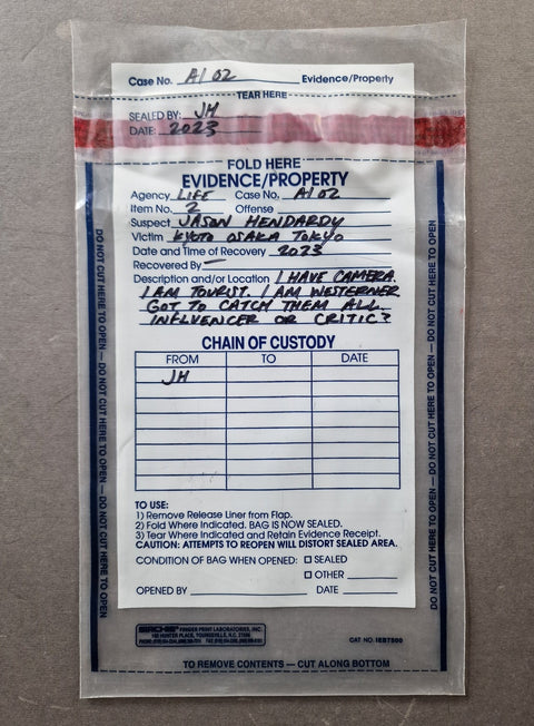 A sealed evidence bag containing an evidence/property log card with printed fields and text, photographed against a light neutral background.