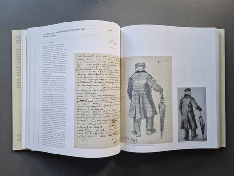 An open book laid flat on a dark surface, showing two printed pages with handwritten script on the left and black-and-white historical illustrations on the right.