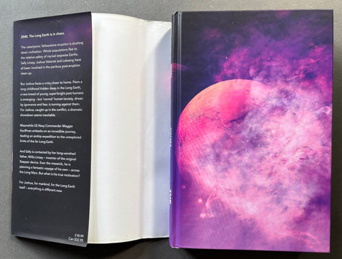 Open book with a colorful space-themed cover on a gray background