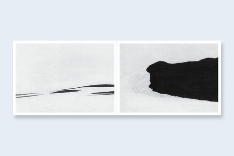 An open book spread featuring two abstract black and white landscapes.