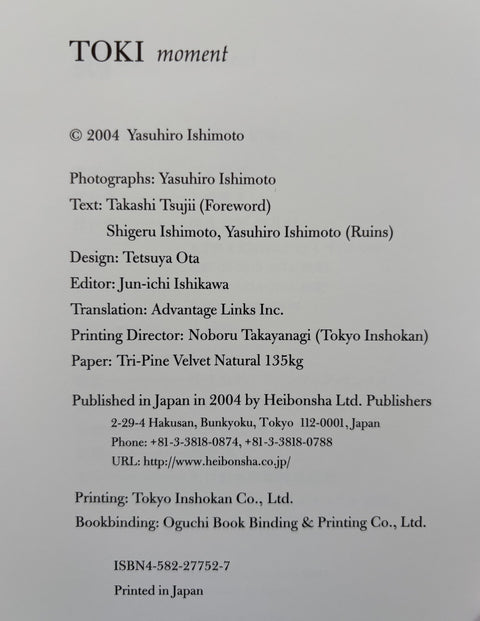 A flat, clean scan of a book's copyright page for 'TOKI moment' by Yasuhiro Ishimoto, printed on light gray paper with black text.
