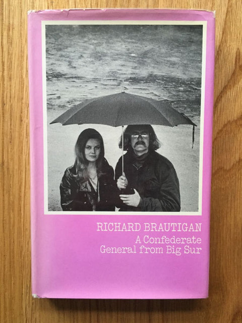 Cover of A Confederate General from Big Sur with a black and white image of a couple standing under an umbrella.