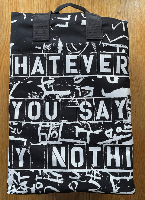 The photography book set of Whatever you Say, Say Nothing by Gilles Peress. IN a bag with 3 large format hardcovers.
